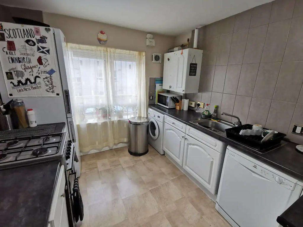 Kitchen with all the standard appliances. Large Fridge Freezer , Microwave, cooker with oven, washing machine and dishwasher
