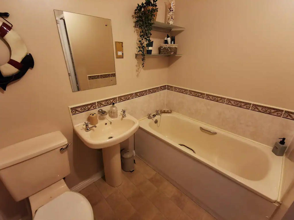 Spacious bathroom with fitted walk in shower and bath
