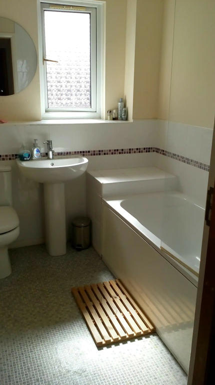 Main family bathroom with shower over bath