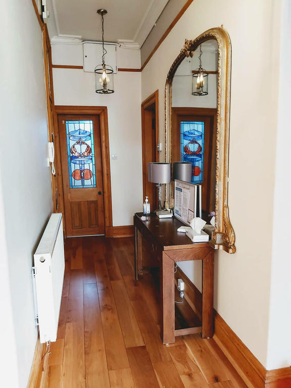 Entrance hallway connecting bathroom, kitchen and sitting room