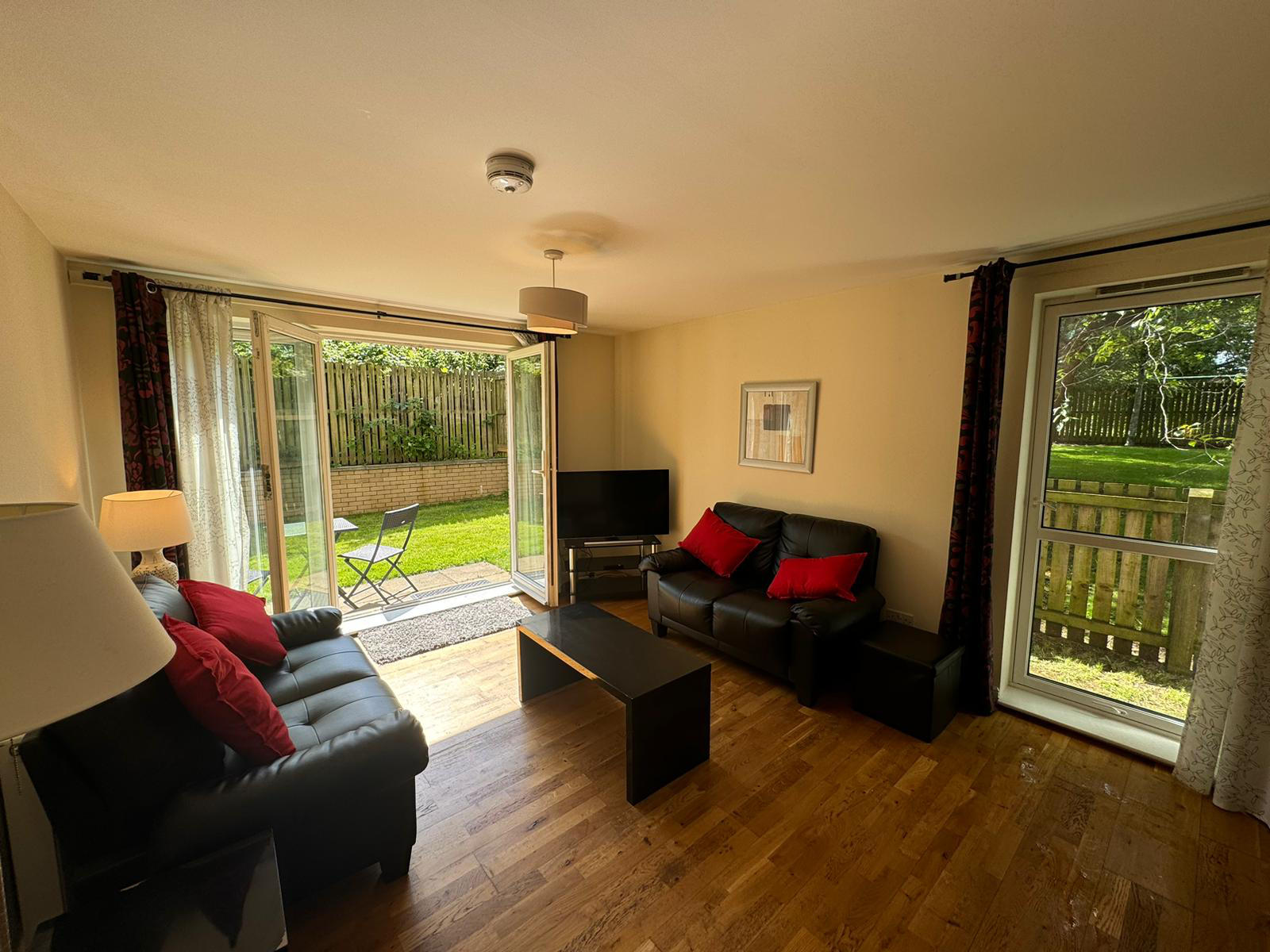 Lounge With French Doors To Private Garden