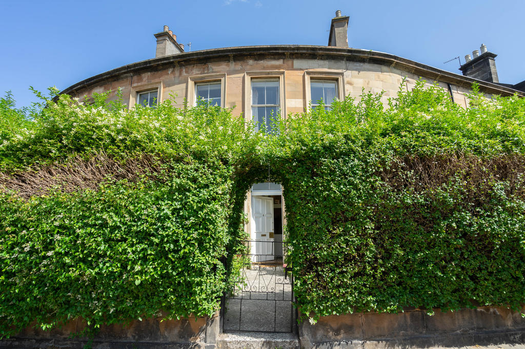 Beautiful architectural curve and luxuriant hedge