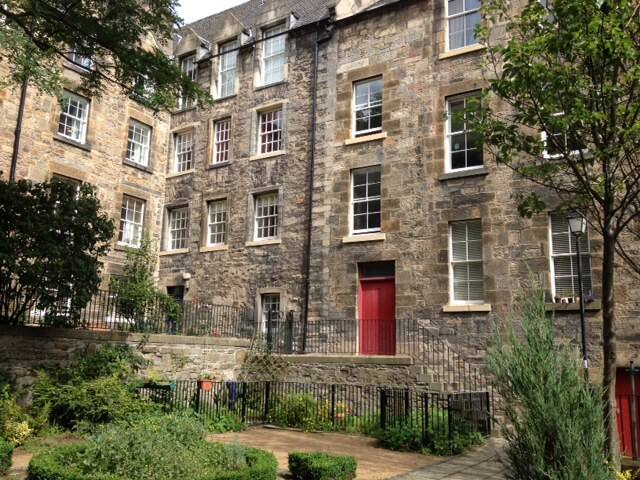 The entrance to the building and paved courtyard