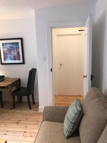 Looking through from the living room towards to bedroom