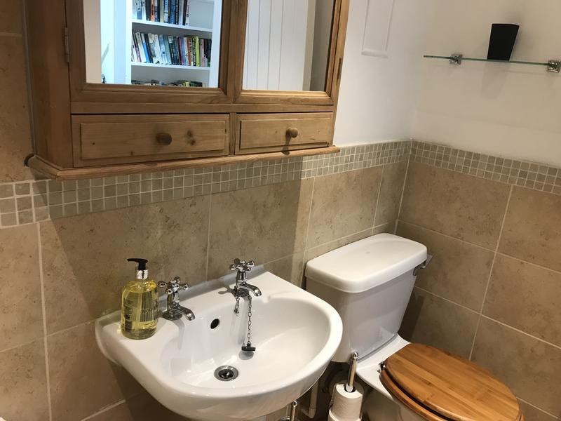 Bathroom with bath tub and shower over