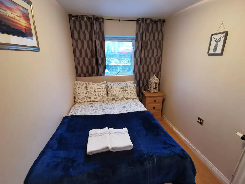 Bedroom 3 with double bed, bedside table and a built-in wardrobe