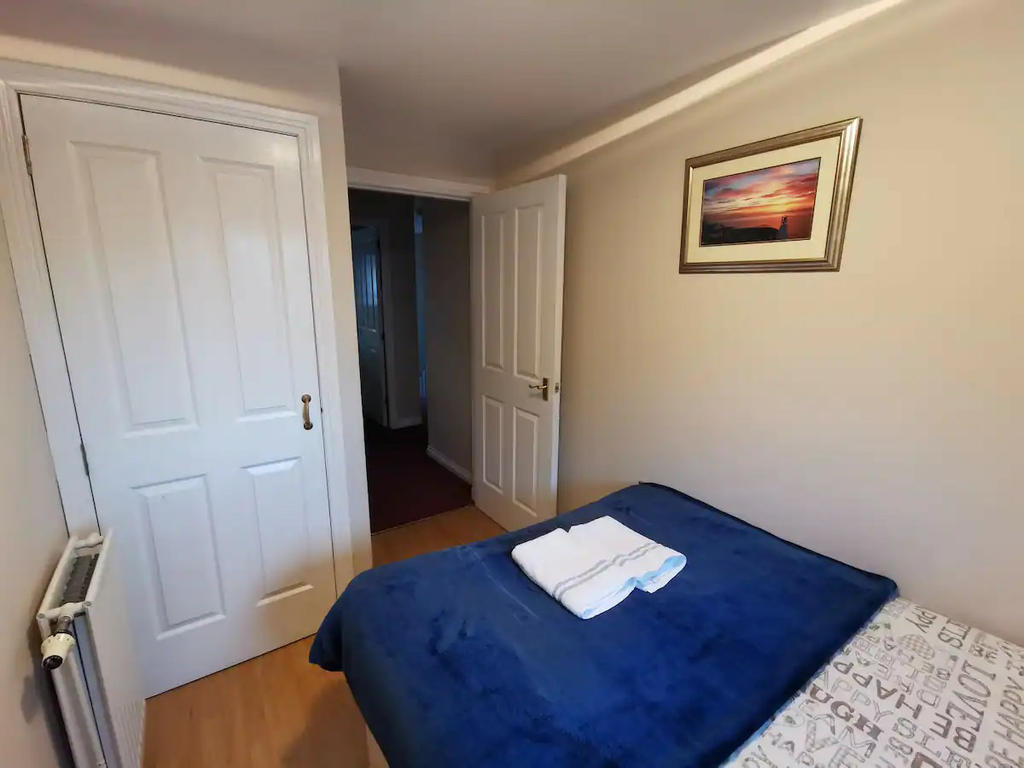 Bedroom 3 with double bed, bedside table and a built-in wardrobe