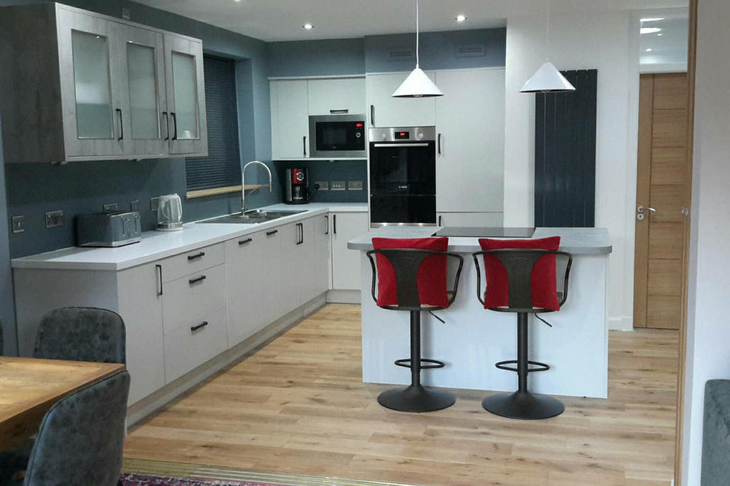 
Spacious kitchen with island including induction hob