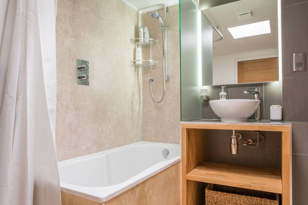 Bathroom with shower and bath on first floor