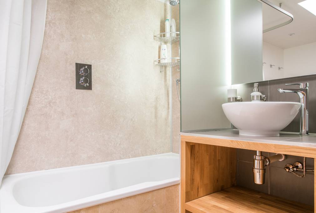 Bathroom with shower and bath on first floor