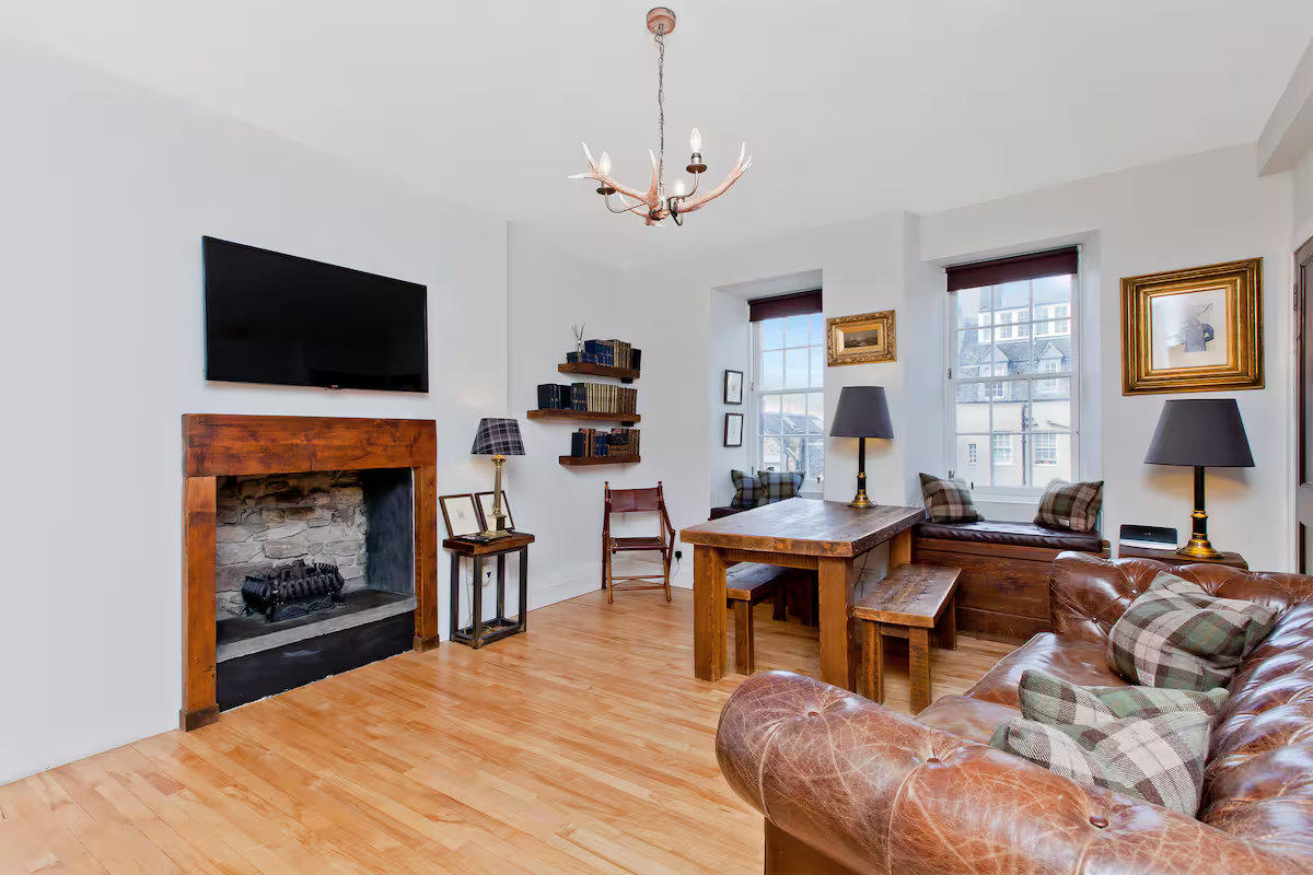 Living/dining area with rustic stone fire place