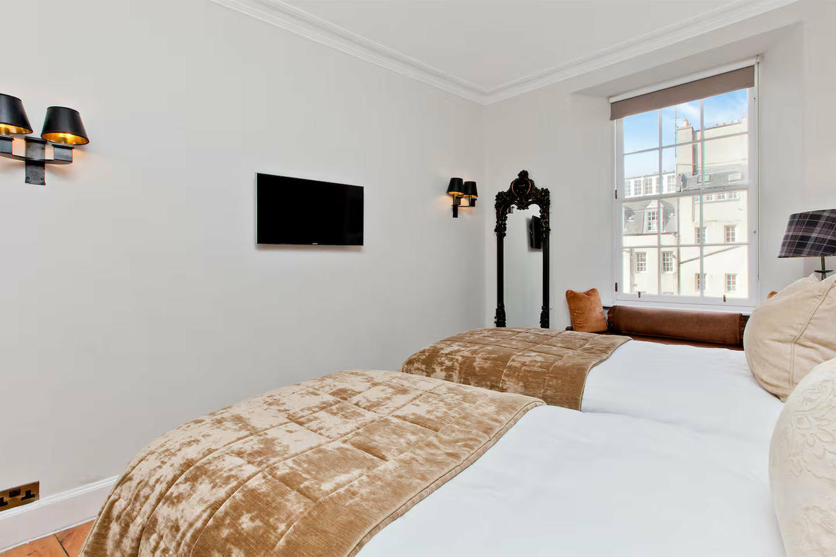 Second bedroom fitted with comfortable twin single beds