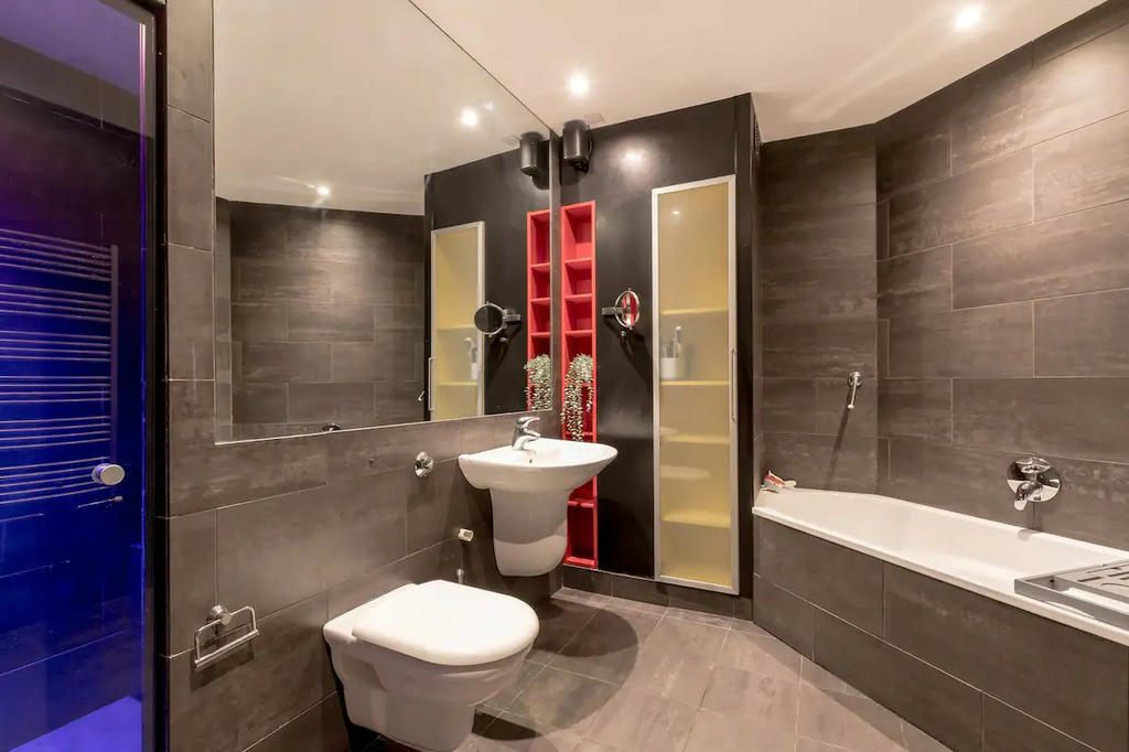 Family bathroom with large mirror ideal for all the family